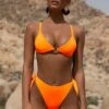 Thong Bikini Bottoms In Neon Orange -Modern Beach Bikini 1882 1 cause a heatwave neon orange clasp thong bikini 1 1d5c3ce1 0fc9 4c9c 9ea4 665d94c4aca4