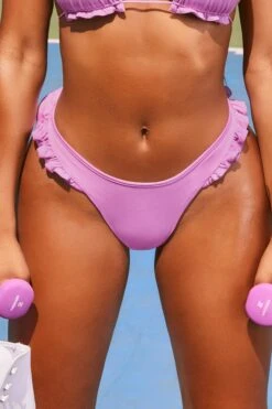 Frill Thong Bikini Bottoms In Lilac -Modern Beach Bikini 2492 5 water baby lilac halterneck spaghetti string frilled bikini top high waisted thong frilled bikini bottoms two piece swimwear 1