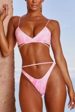 Cut Out Thong Bikini Bottoms In Pink Tie Dye 15 Cut Out Thong Bikini Bottoms In Pink Tie Dye -Modern Beach Bikini 3311 5 wave trip tie dye pink strappy cross over top thongs bikini set 1